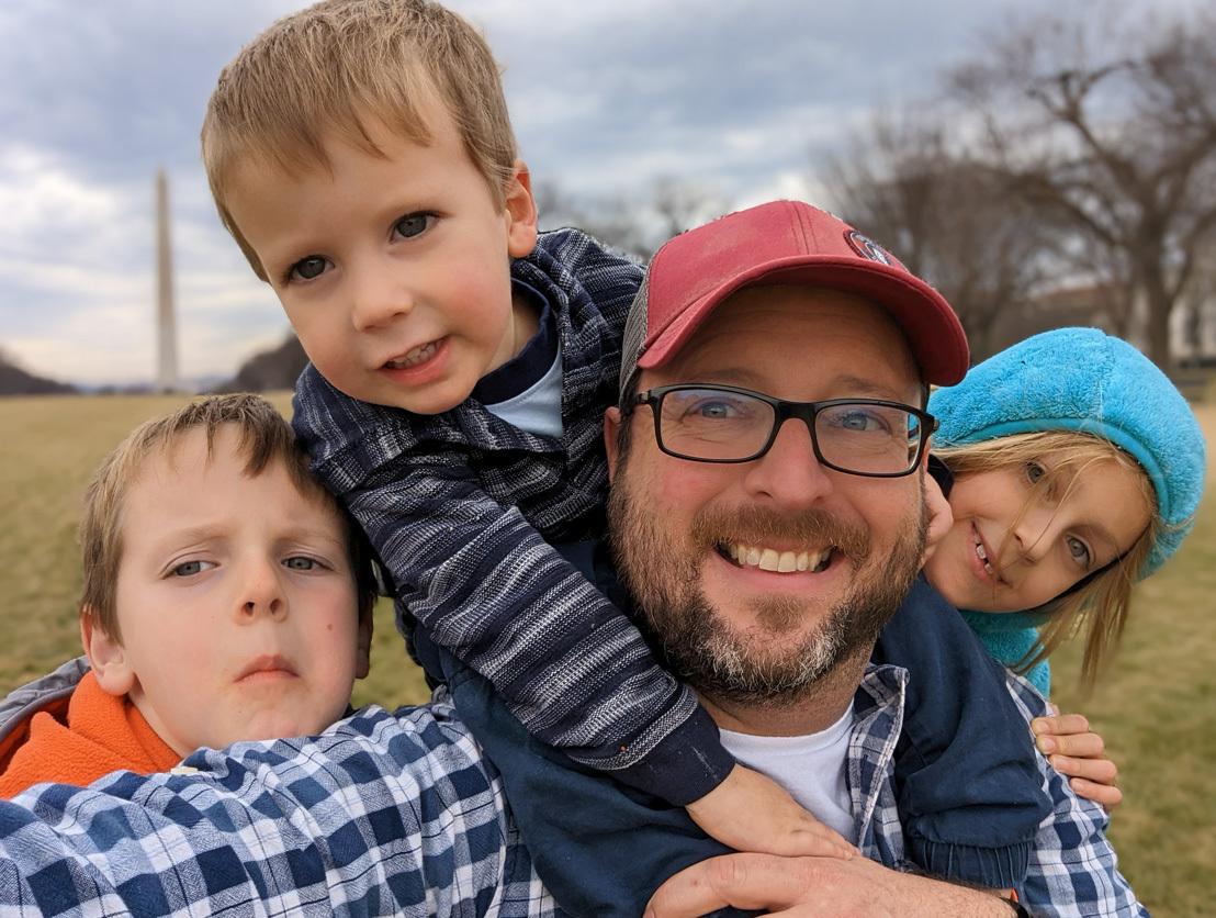 A photo of AWS builder Chris Martenis surrounded by his kids.